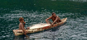 Two fishermen in a canoe, Solomon Islands